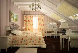 Bedroom in the attic of a wooden house with a sloping ceiling photo