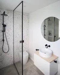 Black and white bathroom with shower photo