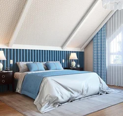 Bedroom design in the attic with a sloping ceiling