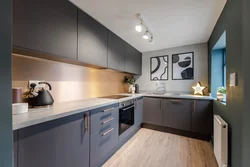 Gray kitchen with a wooden countertop and a wood-effect apron photo