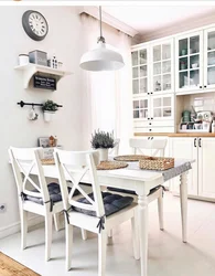 Shelves on the wall in the kitchen above the table photo