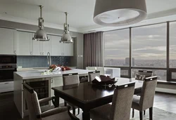 Photo kitchen living room in a house with panoramic windows