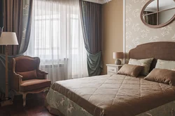 Beige curtains in the bedroom interior