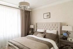 Beige curtains in the bedroom interior