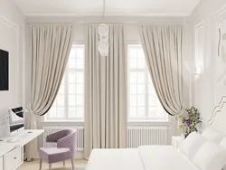 Beige curtains in the bedroom interior