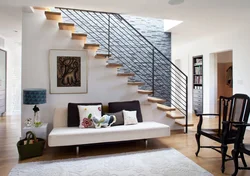 Living room design with stairs to the second floor photo