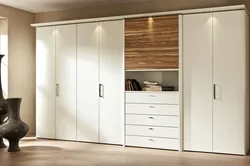 Built-in wardrobe with hinged doors in the bedroom photo