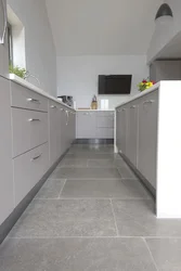 Gray tiles on the kitchen floor photo