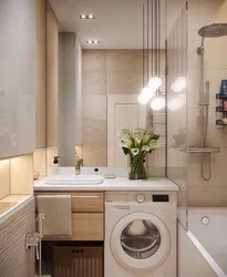 Photo of a small bathtub with a washing machine