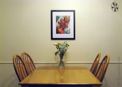 Painting in the kitchen and dining table photo