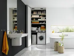 Built-in washing machine in the bathroom in the closet photo