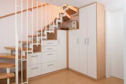 Photo of dressing room design under the stairs