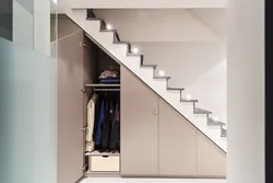 Photo of dressing room design under the stairs