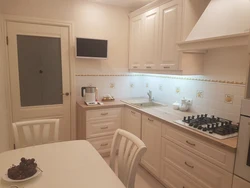 Small kitchen design in beige tones