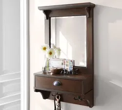 Wall mirror for hallway with shelf photo