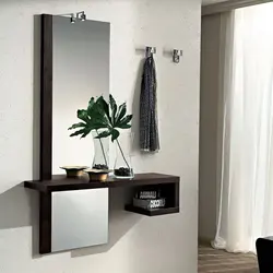 Wall mirror for hallway with shelf photo