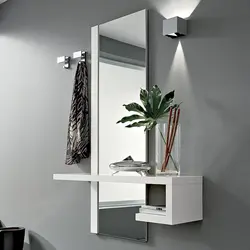 Wall mirror for hallway with shelf photo