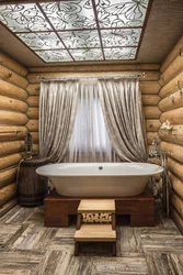 Interior Of A Bathroom In A Wooden House Made Of Logs