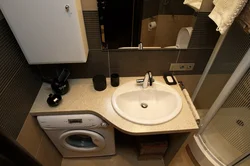 Bath with washbasin and washing machine photo