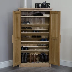 DIY wooden shoe stand in the hallway photo