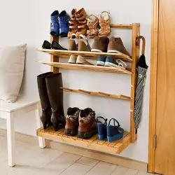 DIY wooden shoe stand in the hallway photo