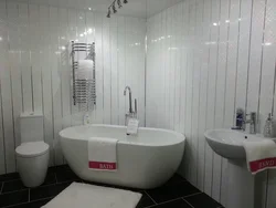 Bathtub with panels and tiles photo