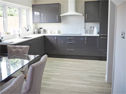 Kitchen with gray walls and white furniture photo