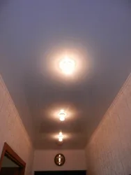 Lamps on a suspended ceiling in the hallway interior photo