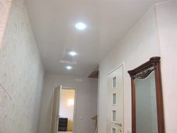 Lamps on a suspended ceiling in the hallway interior photo