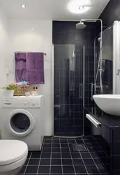 Bath design with shower and washing machine photo