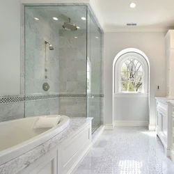 Bathroom design with a corner bathtub in light colors