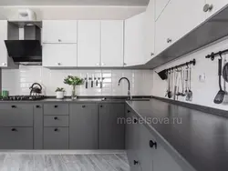 Photo of a gray kitchen combined with white