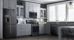 Photo of a gray kitchen combined with white