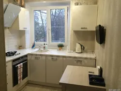 Furnishings of a small kitchen with a refrigerator photo