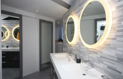 Round mirror in the bathroom interior