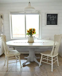 Round Wooden Table In The Kitchen Interior