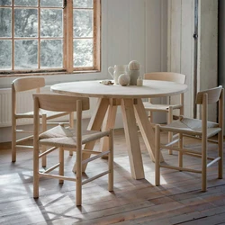 Round wooden table in the kitchen interior