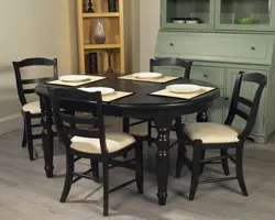 Round Wooden Table In The Kitchen Interior