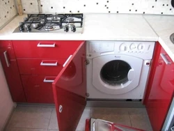 Kitchen with washing machine and stove photo