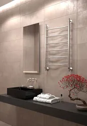 Heated towel rail in the bathroom interior