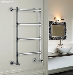 Heated towel rail in the bathroom interior