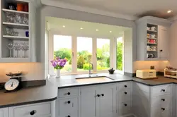 Kitchen Living Room With Sink By The Window In The House Photo