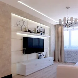 Photo of a living room with a TV on the wall