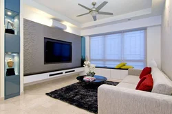 Photo of a living room with a TV on the wall