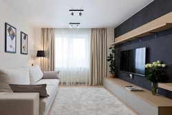 Interior of a walk-through living room with a balcony