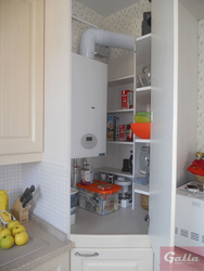 Interior of a small kitchen with a boiler