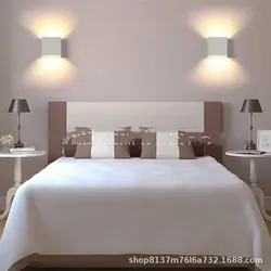 Sconce lamp on the wall in the bedroom photo