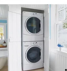 Washer and dryer in a column in the bathroom interior