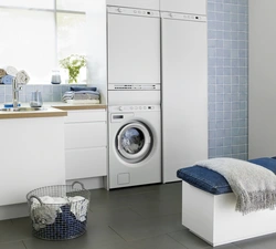 Washer and dryer in a column in the bathroom interior