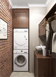 Washer and dryer in a column in the bathroom interior